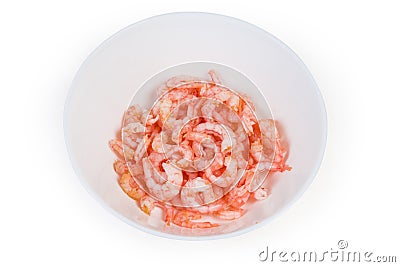 Cooked and peeled shrimp tails in white bowl Stock Photo