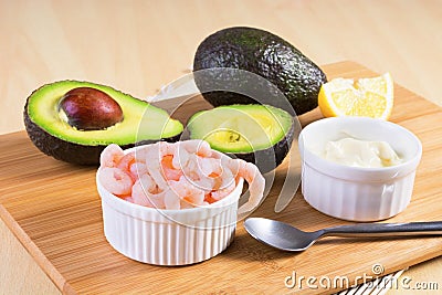 Cooked peeled shrimps with avocado and white sauce Stock Photo