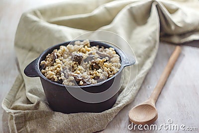 Cooked for the pot of bulgur porridge with mushrooms. The concept of proper healthy simple and wholesome food Stock Photo