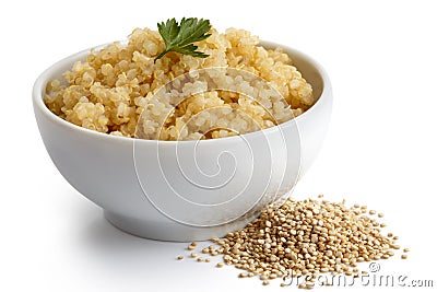 Cooked quinoa in white ceramic bowl isolated on white with green Stock Photo