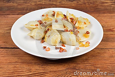 Cooked savory filled dumplings flavored with fried bacon and onion Stock Photo