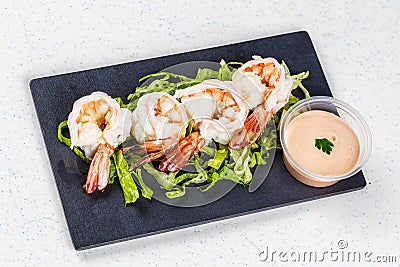 Cooked shrimps on black slate Stock Photo