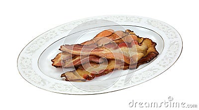 Cooked smoked bacon on platter Stock Photo