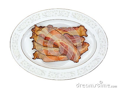 Cooked smoked bacon slices on platter Stock Photo