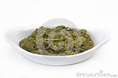 Cooked spinach dish on a white background Stock Photo