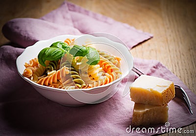 Cooked spiral macaroni with basil Stock Photo