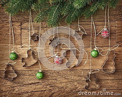 Cookie cutter and christmas baubles Stock Photo