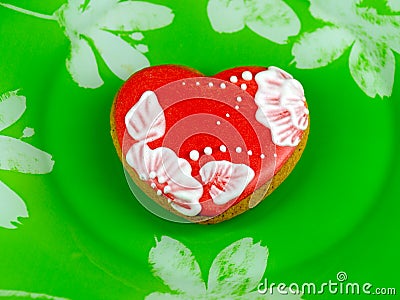Cookie heart on green background Stock Photo