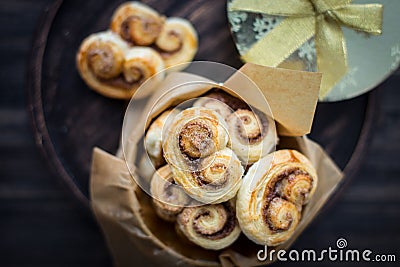 Cookies, curlicues, pretzels of puff pastry with sugar and cinnamon Stock Photo