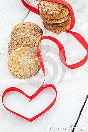 cookies, milk bottle on a white wooden background, and the heart Stock Photo