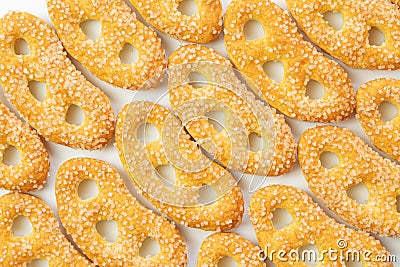 Cookies of yellow color, sweet pretzels in sugar, large crystals of sugar, on a white background, isolated Stock Photo