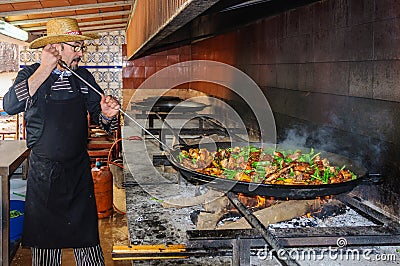 Cooking of an authentic paella in Valencia, Spain Editorial Stock Photo