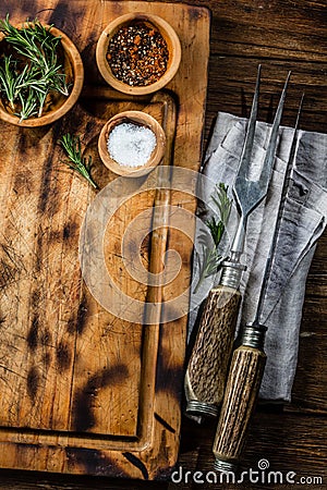 Cooking background concept. Vinrage cutting board with cutlery. Top view Stock Photo