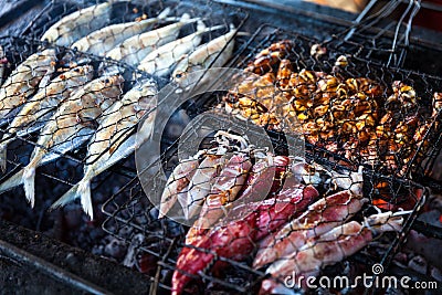 Cooking BBQ seafood on background fire Stock Photo