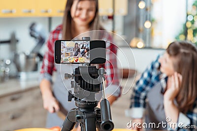 Cooking blog two women shooting video smartphone Stock Photo