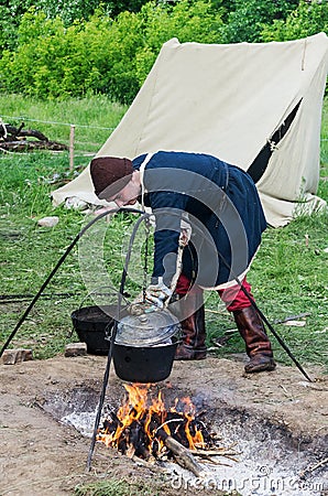 Cooking on a campfire camping Editorial Stock Photo