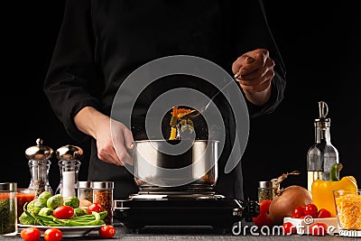 Cooking by the chef in the kitchen. Recipes and cooking, gastronomy. Culinary background. Italian pasta with ingredients Stock Photo