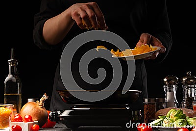 Cooking by the chef in the kitchen. Recipes and cooking, gastronomy. Culinary background. Proper and Dietary Nutrition Stock Photo