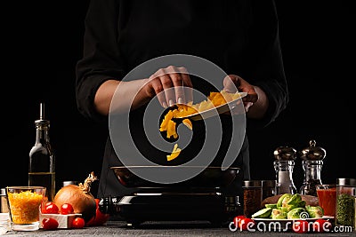 Cooking by the chef in the kitchen. Recipes and cooking, gastronomy. Culinary background. Proper and Dietary Nutrition Stock Photo