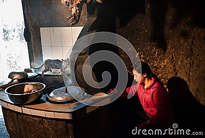 A cooking chinese girl Editorial Stock Photo