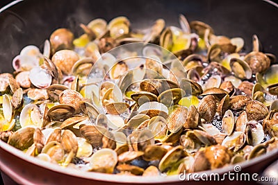 Cooking clams in a pan Stock Photo