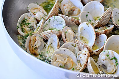 Cooking clams with white sauce Stock Photo