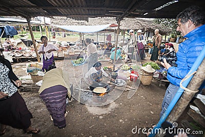 Cooking confectionery at the market. Editorial Stock Photo