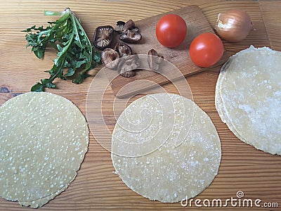 Cooking dandelion mushrooms tomato rolls Stock Photo