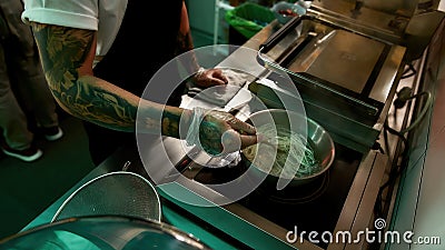 Cooking delicious noodles in a restaurant Stock Photo