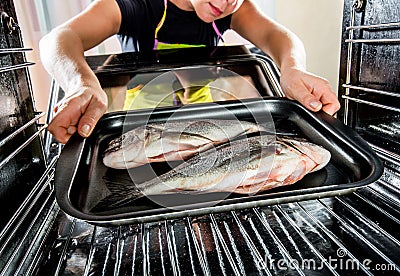 Cooking Dorado fish in the oven. Stock Photo