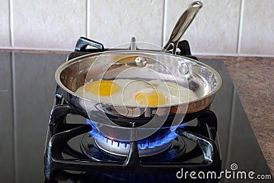 Cooking eggs Stock Photo