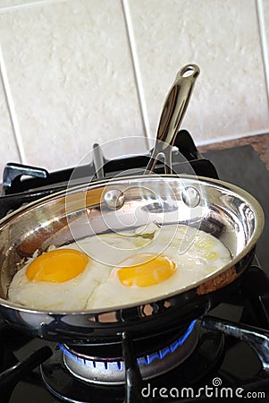 Cooking eggs Stock Photo