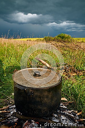 Cooking on a fire. outdoor Stock Photo