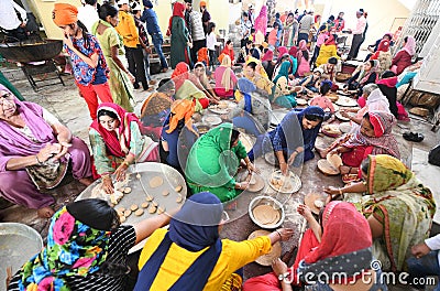 Cooking Food in the Kitchen of a Gurudwara Editorial Stock Photo