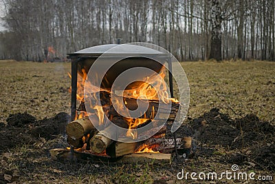 Cooking food in nature. Field kitchen in a campaign or on hunting or fishing Stock Photo