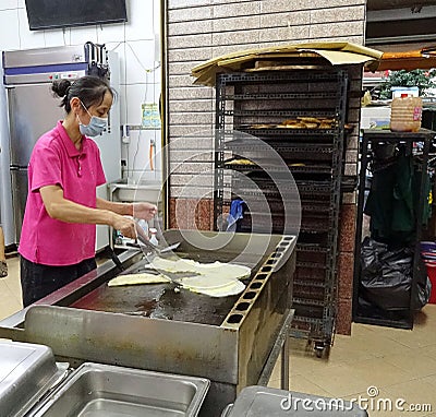 Cooking Fried Pancakes with Egg and Spring Onions Editorial Stock Photo