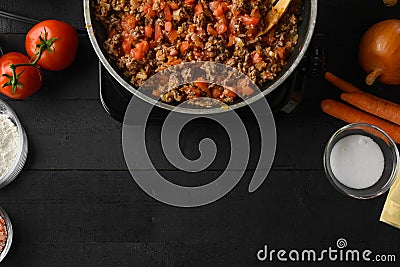 Cooking Italian lasagna, frying in a skillet dressing. Background for design. Cooking process. Top view Stock Photo