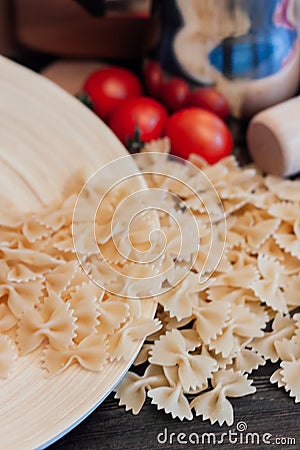 cooking italian pasta by hand kitchen cherry tomatoes ingredients lunch Stock Photo