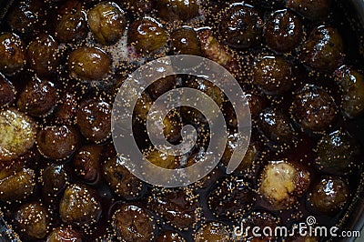 Cooking jam of figs in a bowl Stock Photo