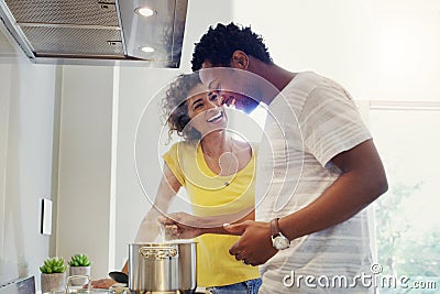 Cooking, love and happy with couple in kitchen for bonding, breakfast and morning. Happiness, smile and food with man Stock Photo