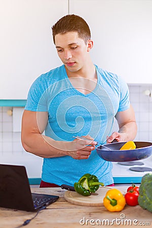 Cooking man vegetables recipe computer portrait format eating Stock Photo