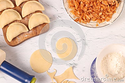 Cooking national Ukrainian dumplings with cabbage at home Stock Photo