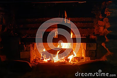 Cooking over the open fire at the Gouland Downs DoC hut on the Heaphy Track Stock Photo