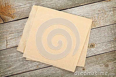 Cooking paper over wooden table Stock Photo