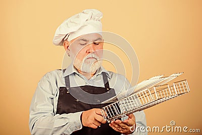 Cooking with passion. senior man in chef hat. cook men with beard. cooking utensils for barbecue. he prefer grill food Stock Photo