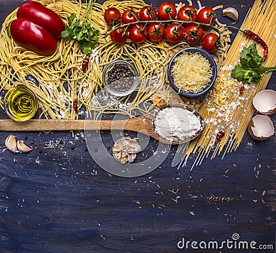 Cooking pasta concept with tomatoes, parmesan cheese, pepper, spices, flour, garlic, wooden spoon, border, with text area on blue Stock Photo