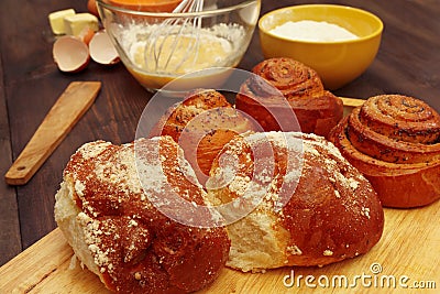 Cooking pastries from natural ingredients to fresh buns on wooden table Stock Photo