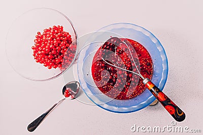 cooking process of rubbed red currant with sugar with fresh berries Stock Photo