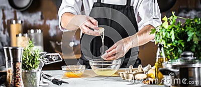 Cooking, profession and people concept - male chef cook making food at restaurant kitchen Stock Photo