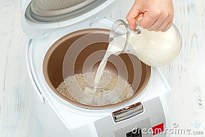 Cooking rice porridge in multicooker Stock Photo